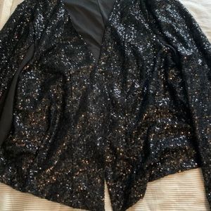 Open front sequin jacket.